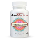 A white bottle with a label that reads 'Sudarshan Ghan Vati Tablets' from the brand AyuMantra. The label features a colorful floral design and text indicating that it is a dietary supplement with 60 tablets.