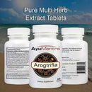 AyuMantra Arogtrifla dietary supplement bottles with a beach background.