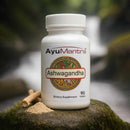 AyuMantra Ashwagandha supplement bottle on a natural background.