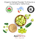 Organic herbal powder with ghee and leaves, featuring certification logos and AyuMantra branding.