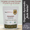 Package of AyuMantra Amalaki Powder with branding and product details on a light gray background