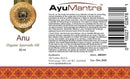 Label of AyuMantra Organic Ayurvedic Oil with product details and branding.