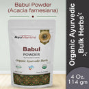 Package of AyuMantra Babul Powder with branding and product details on a light gray background
