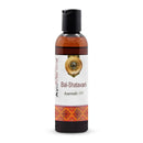 Ayurvedic oil bottle with a white label featuring text and a logo on a white background