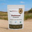 AyuMantra Dashmool Powder packaging on a desert background
