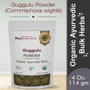 Package of AyuMantra Guggulu Powder with branding and product details on a light gray background.