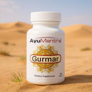 AyuMantra Gurmar dietary supplement bottle in a desert setting