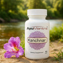 AyuMantra Kanchnar dietary supplement bottle with a pink flower on a natural background