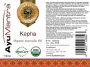 Label of AyuMantra Kapha Organic Ayurvedic Oil with branding and product details.