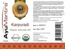 Label of AyuMantra Karpuradi Organic Ayurvedic Oil with product details and branding.