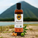 Bottle of Karpuradi Ayurvedic oil with natural elements and mountain background