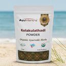 AyuMantra Kolakulathadi Powder packaging on a beach background