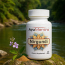 AyuMantra Nirgundi dietary supplement bottle with a natural background