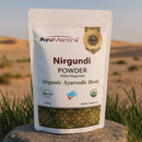 AyuMantra Nirgundi Powder packaging with a desert landscape in the background