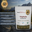 AyuMantra Triphala Powder packaging with mountainous background