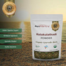 Ayurvedic Kolakulathadi powder packaging with benefits and product details on a wooden surface.