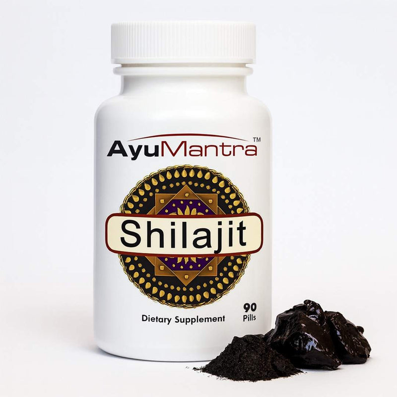 AyuMantra Shilajit pills bottle with Shilajit resin chunks and powder, Ayurvedic mineral supplement product