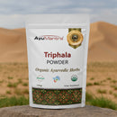 AyuMantra Triphala Powder packaging with desert background