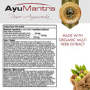 Product information card for AyuMantra Pure Ayurveda tablets, showing the brand logo, a gold seal, product facts in English and French, usage warnings, and a small product photo of tablets with fruits at the bottom.