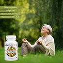 Woman sitting outdoors with a bottle of AyuMantra Trishla supplement.