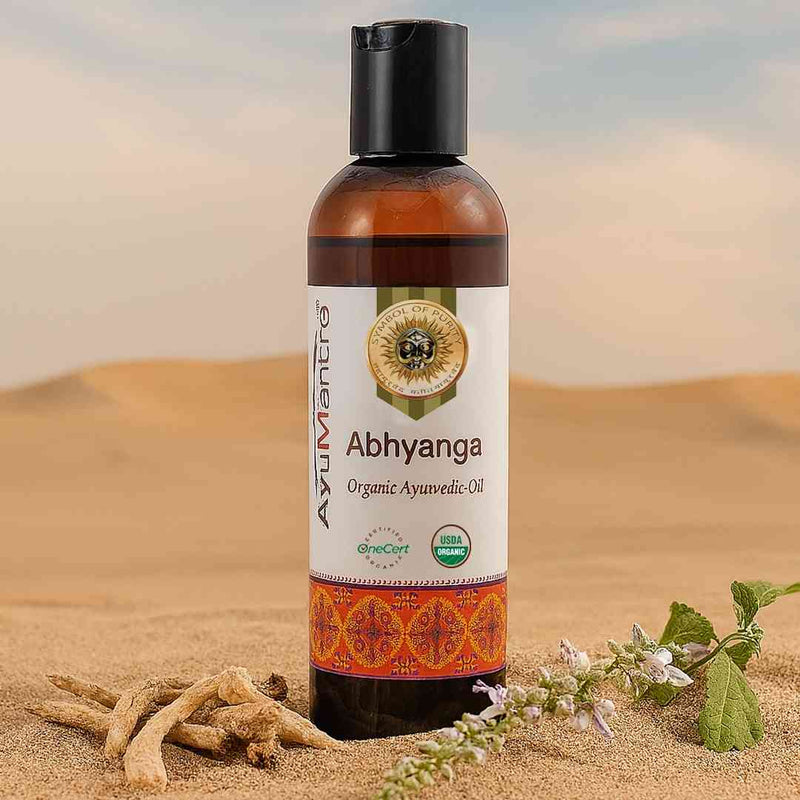 Bottle of Ayurvedic Abhyanga oil with a desert background