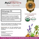 AyuMantra Abhyanga Oil packaging with ingredients list, certification logos, and product description.