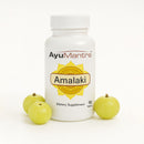 AyuMantra Amalaki dietary supplement bottle with three Amalaki fruits on a white background.