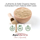 Ayumantra Anantmool Powder in a wooden bowl with scoop and icons for gluten free, organic, vegan.