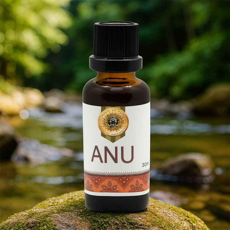 Bottle of ANU oil on a mossy rock with a natural background