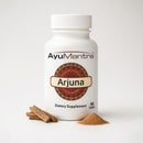 AyuMantra Arjuna dietary supplement bottle with cinnamon sticks and powder on a white background.