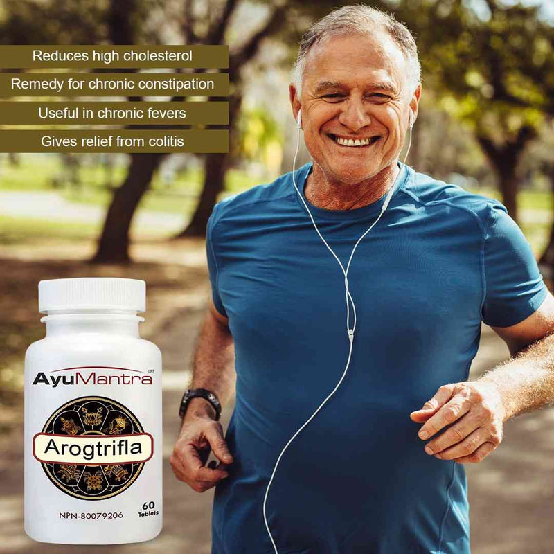 Arogtrifla tablets bottle beside smiling older man jogging in park, supporting healthy metabolism.