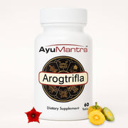Arogtrifla tablets bottle with herbal fruits and  red flower arranged on clean white background.