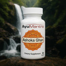 AyuMantra Ashoka Ghan dietary supplement bottle with a waterfall in the background.