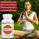 AyuMantra Ashoka Ghan supplement bottle with a woman meditating outdoors.