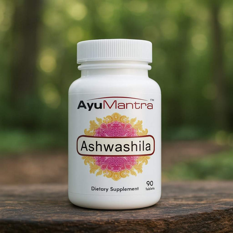 Ashwashila tablets bottle on wooden surface outdoors with blurred forest background.