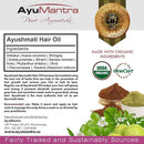 AyuMantra Ayushmati Hair Oil packaging with ingredients list, organic certification logos, and natural product imagery.