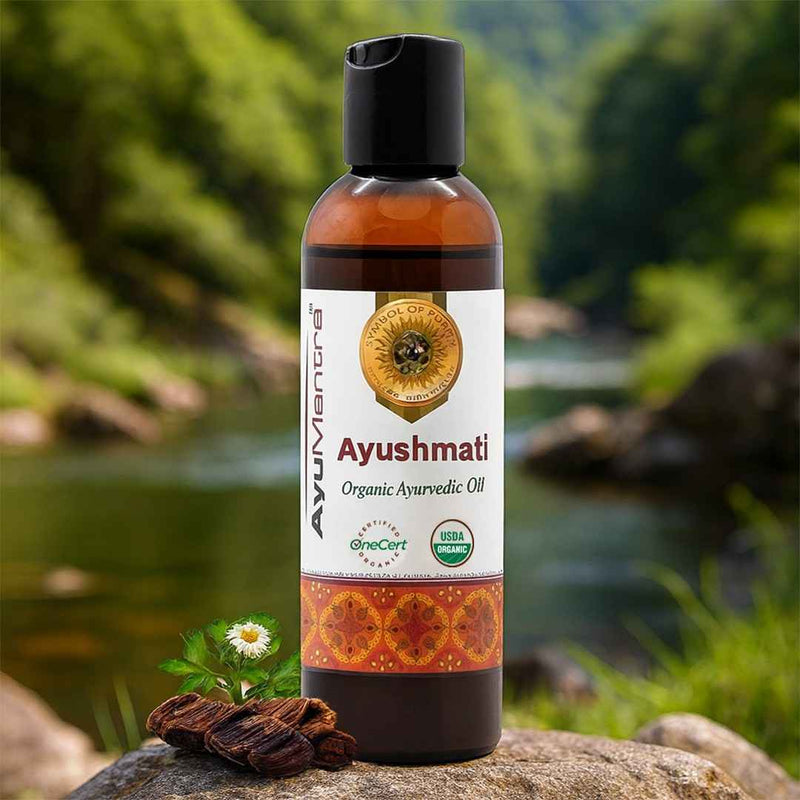 Ayushmati Organic Ayurvedic Oil bottle with a natural background