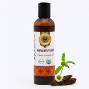 Bottle of Ayushmati Organic Ayurvedic Oil with a white background