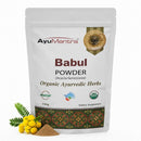 AyuMantra Babul Powder packaging with herbs on a white background