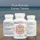 Three Ayumantra Bhibitaki tablets bottles with text “Pure Bhibitaki Extract Tablets” against a seashore backdrop.