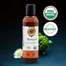 Bhringraj organic ayurvedic oil bottle with USDA and OneCert organic certification logos on a dark background.
