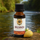 Bottle of Bilvadi oil with a natural background