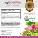 AyuMantra Brahmi Amla Oil packaging with ingredients list, certification logos, and product description.