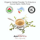 Organic herbal powder in a white scoop with certification logos and AyuMantra branding on a white background.