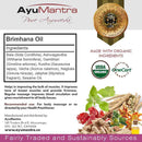 AyuMantra Brimhana Oil packaging with ingredients list, organic certification logos, and product description.