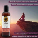 Bottle of Brimhana Ayurvedic Oil with a person meditating on a cliff in the background