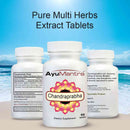 Ayurvedic supplement bottles labeled 'AyuMantra Chandraprabha' on a beach with ocean view.