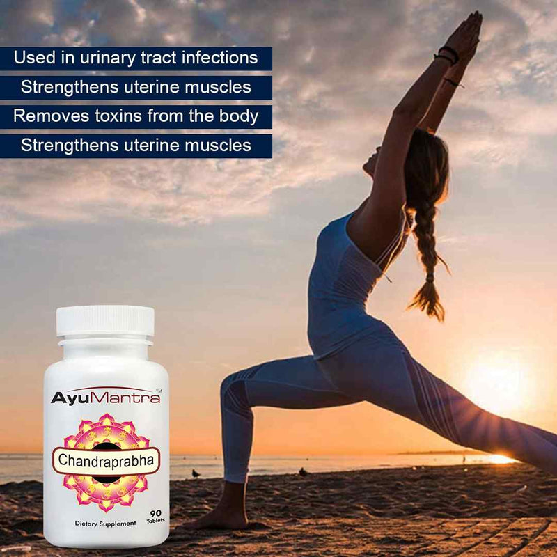 Woman practicing yoga on a beach with AyuMantra Chandraprabha supplement bottle displayed.
