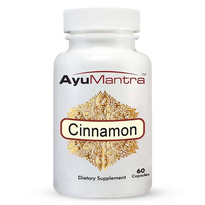 Front view of AyuMantra cinnamon capsules bottle showing golden herbal label design.