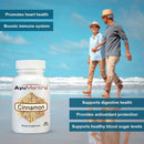 AyuMantra Cinnamon supplement bottle with a beach background and text highlighting health benefits.